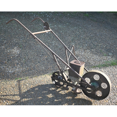 414 - An antique cast iron garden seeder a/f