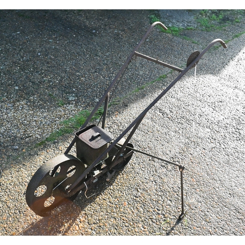 414 - An antique cast iron garden seeder a/f