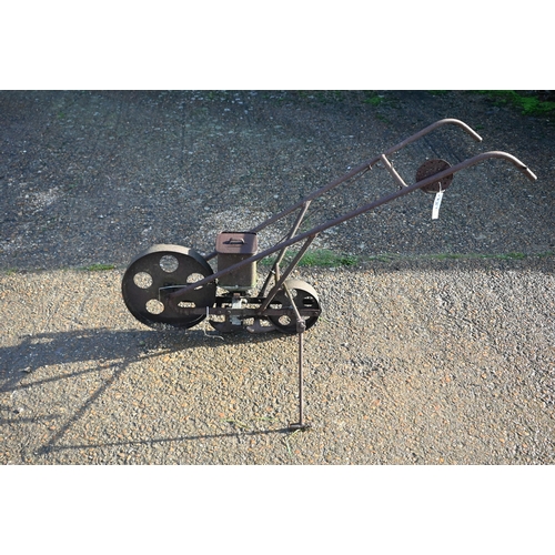 414 - An antique cast iron garden seeder a/f