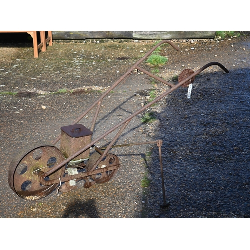 414 - An antique cast iron garden seeder a/f