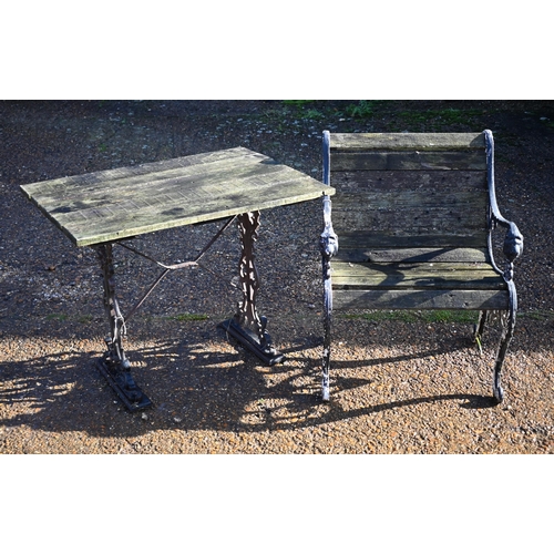 415 - A weathered teak and cast iron garden table, 90 cm wide x 66 cm deep x 72 cm high to/w a somewhat si... 