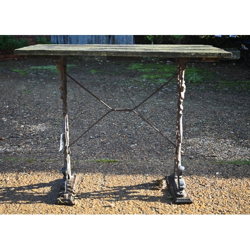 415 - A weathered teak and cast iron garden table, 90 cm wide x 66 cm deep x 72 cm high to/w a somewhat si... 