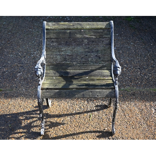 415 - A weathered teak and cast iron garden table, 90 cm wide x 66 cm deep x 72 cm high to/w a somewhat si... 