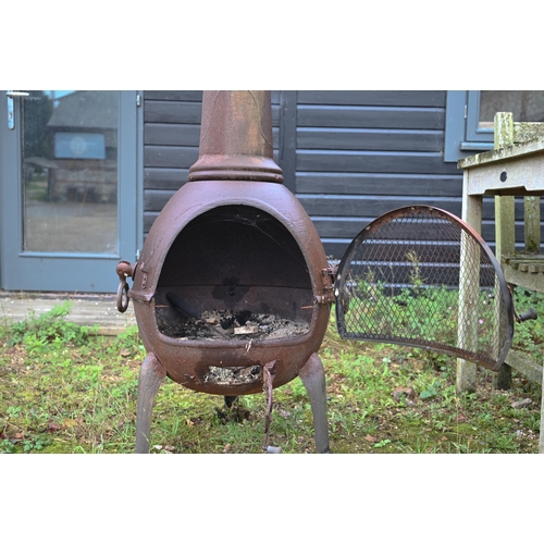 423 - A cast iron patio heater/chimenea, 140 cm high