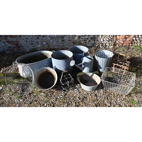 424 - A galvanised garden bath planter 84 cm wide to/w pair of bucket planters, watering can, two oyster b... 