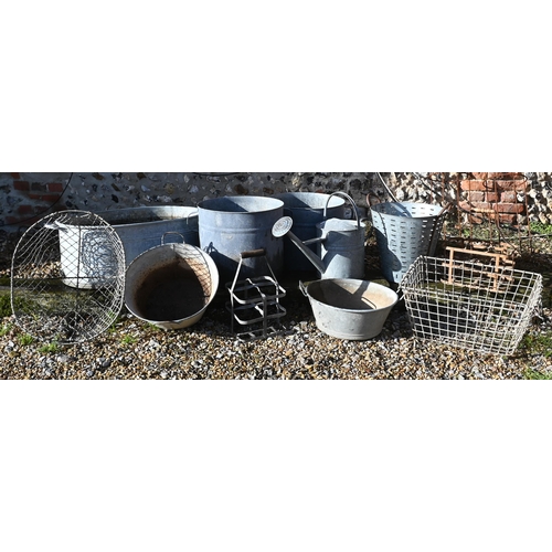 424 - A galvanised garden bath planter 84 cm wide to/w pair of bucket planters, watering can, two oyster b... 