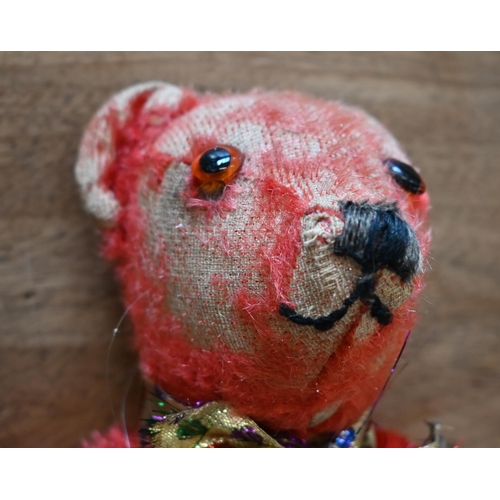 433 - A vintage red-plush teddy-bear with glass eyes, stitched nose and rotating limbs with replacement pa... 