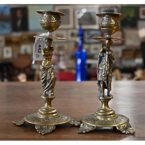 442 - A pair of Victorian brass candlesticks, the columns cast with classical female figures to/w a betel-... 