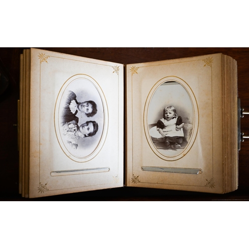 444 - A Victorian embossed leather photograph album with gilt brass lock, containing a quantity of family ... 