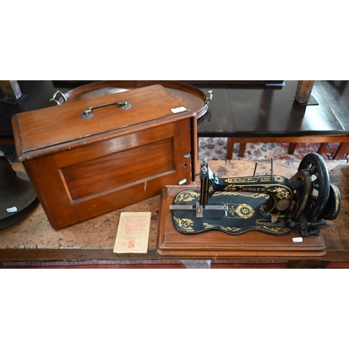 460 - # An antique Singer sewing machine with case