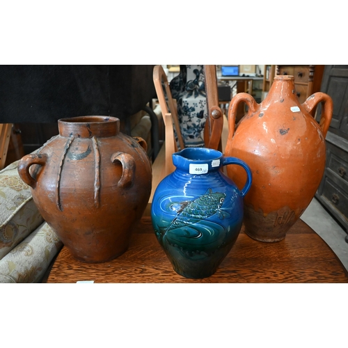 469 - An Arts & Crafts Brannam Barum blue glazed jug decorated with fish, 28 cm to/w a Mediterranean o... 