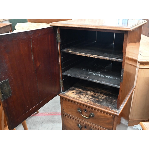 47 - A 19th century mahogany drinks cabinet with panelled door over three drawers, 52 cm wide x 45 cm dee... 