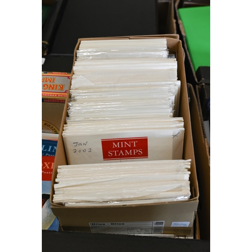 483 - A large quantity of postage stamps, first day covers and postcards - mostly Elizabeth II to/w empty ... 