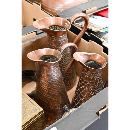 488 - A graduated (matched) set of three Arts & Crafts copper jugs by Joseph Sankey, embossed with cro... 