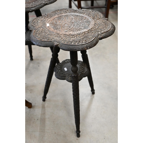 53 - A pair of early 20th century Indian caned harwood occasional tables, 40 cm diam x 60 cm high to/w an... 