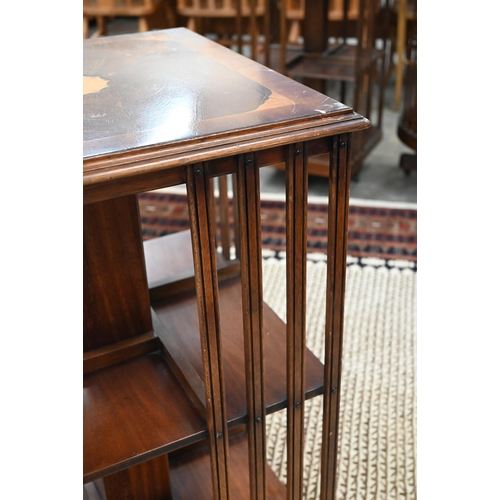 58 - A reproduction mahogany satin inlaid revolving bookcase, 50 x 50 x 80 cm high