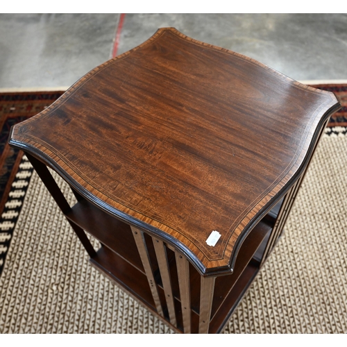 59 - A reproduction mahogany and satin banded revolving bookcase with serpentine square top, open sides a... 