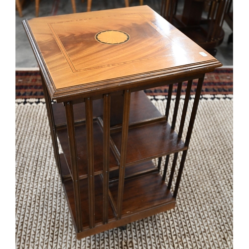 61 - A reproduction bleached mahogany inlaid revolving bookcase, 46 x 46 x 78 cm high