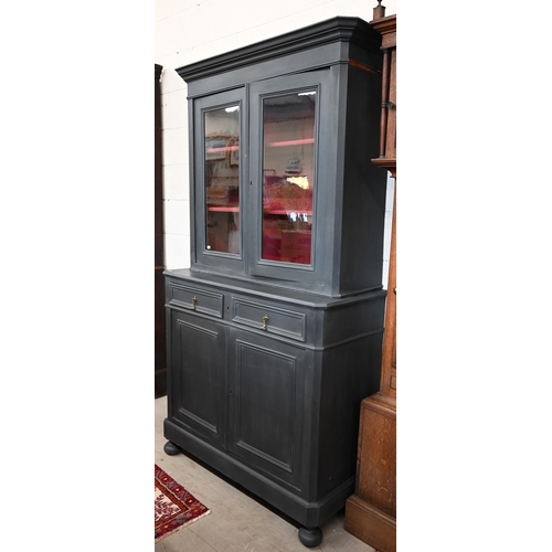 63 - An antique slate open painted bookcase cabinet, the top section with glazed doors enclosing contrast... 