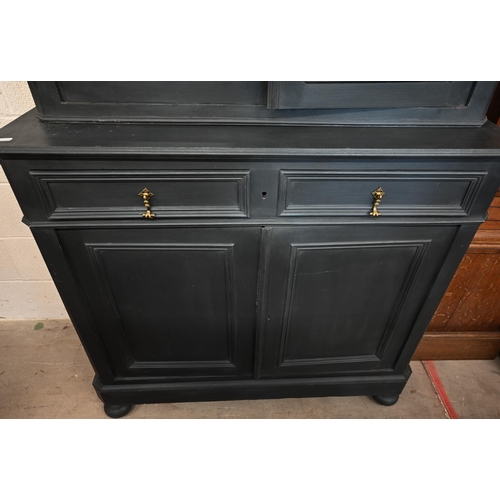 63 - An antique slate open painted bookcase cabinet, the top section with glazed doors enclosing contrast... 