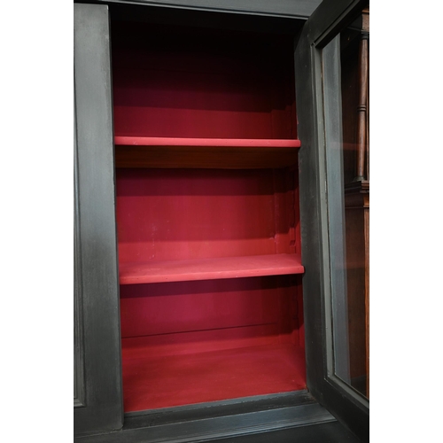 63 - An antique slate open painted bookcase cabinet, the top section with glazed doors enclosing contrast... 