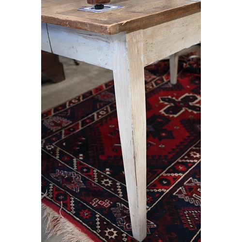 64 - A French fruitwood rustic kitchen dining table with cleated top on distressed white-painted base, 13... 