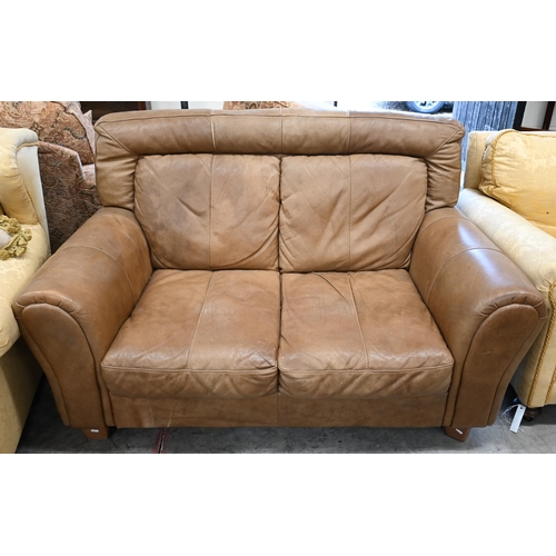 67 - A tan leather two seater sofa, 150 x 100 x 90 cm high