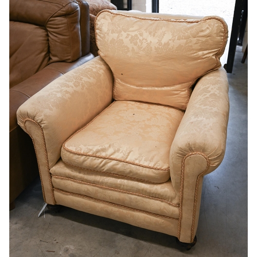 68 - # A wingback armchair, in old gold damask upholstery, to/w another armchair with matching fabric (2)