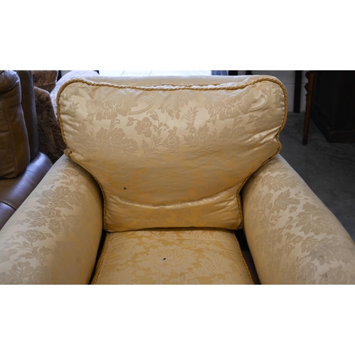 68 - # A wingback armchair, in old gold damask upholstery, to/w another armchair with matching fabric (2)