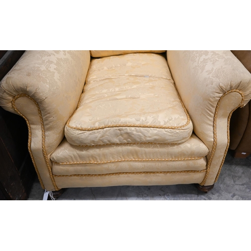 68 - # A wingback armchair, in old gold damask upholstery, to/w another armchair with matching fabric (2)