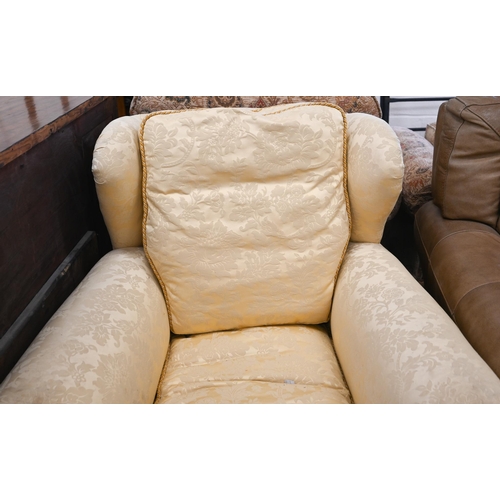 68 - # A wingback armchair, in old gold damask upholstery, to/w another armchair with matching fabric (2)