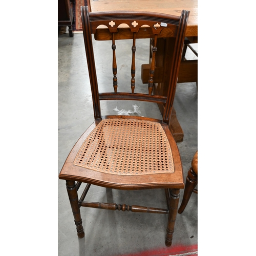 69 - An Edwardian walnut cane seated side chair to/w mahogany nursing chair with caned back and seat (2)