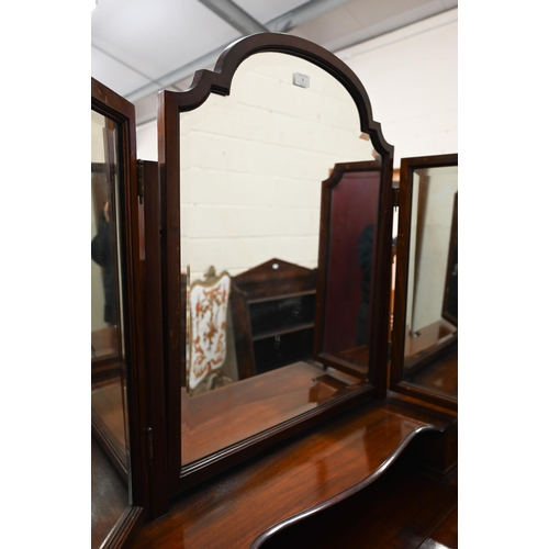 7 - An Edwardian walnut inlaid dressing table, the raised back with levelled triptych mirror, on slender... 