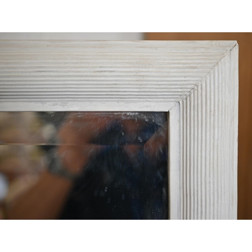 80 - A large bevelled rectangular mirror in moulded cream painted wooden frame, 168 x 102 cm