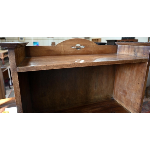 81 - A mahogany escritoire/secretary desk with fall front panel enclosing fitted interior over four drawe... 