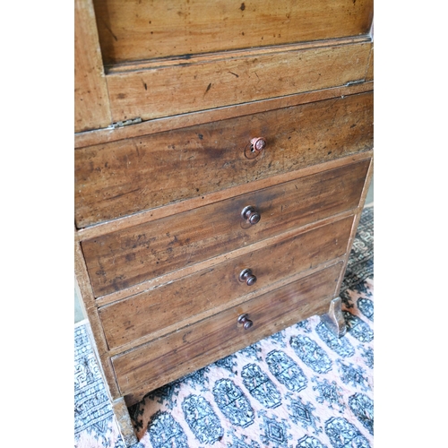 81 - A mahogany escritoire/secretary desk with fall front panel enclosing fitted interior over four drawe... 