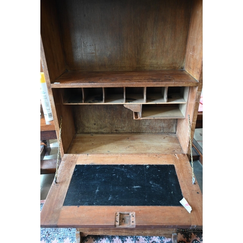 81 - A mahogany escritoire/secretary desk with fall front panel enclosing fitted interior over four drawe... 