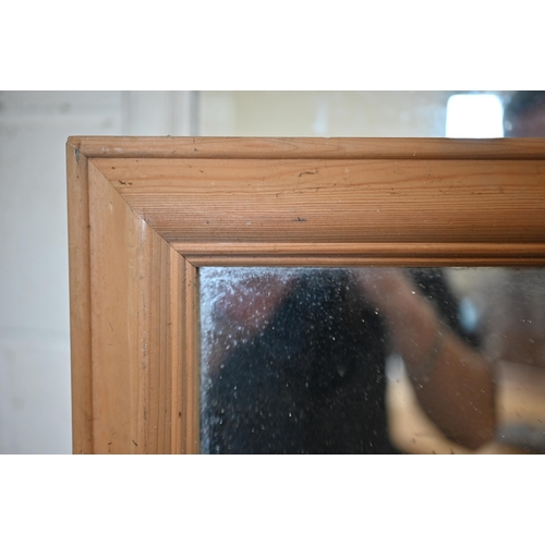 82 - A rectangular mirror in moulded pine frame, 136 x 104 cm