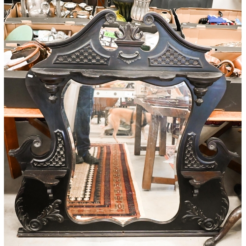 85 - A Victorian carved and ebonised overmantel mirror, 130 cm wide x 134 cm high