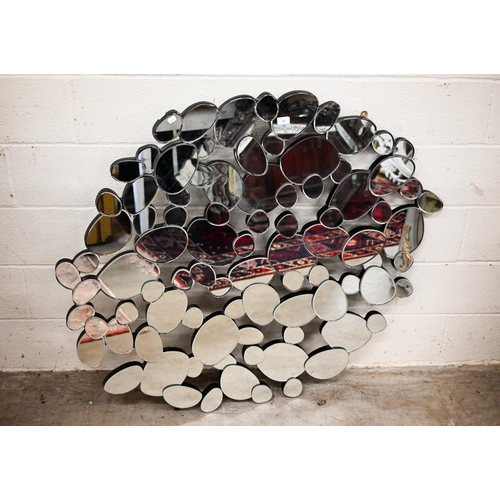 94 - A modern abstract 'pebble' design mirror, 127 cm wide x 114 cm high