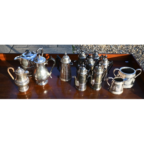 497 - A set of six electroplated coffee pots, two other coffee pots, two hot water jugs and a milk and sug... 