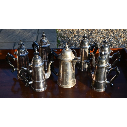 497 - A set of six electroplated coffee pots, two other coffee pots, two hot water jugs and a milk and sug... 