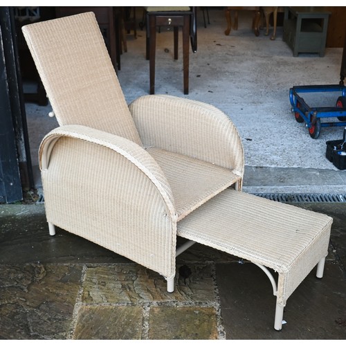 112 - A bamboo and wicker conservatory armchair, a wicker armchair with adjustable highback and pull-out s... 