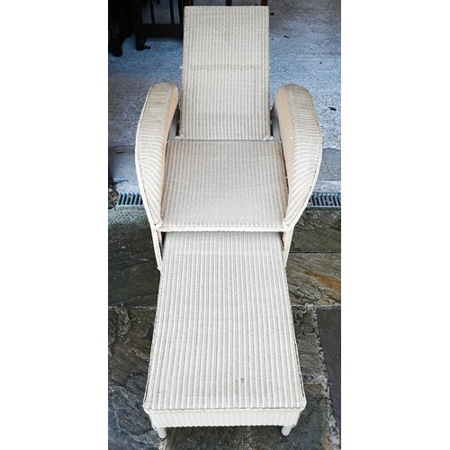 112 - A bamboo and wicker conservatory armchair, a wicker armchair with adjustable highback and pull-out s... 