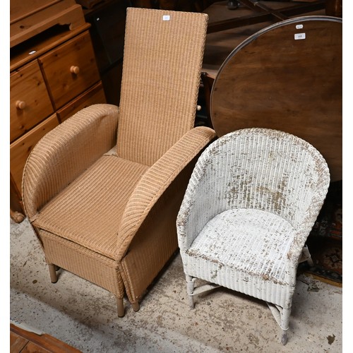 112 - A bamboo and wicker conservatory armchair, a wicker armchair with adjustable highback and pull-out s... 