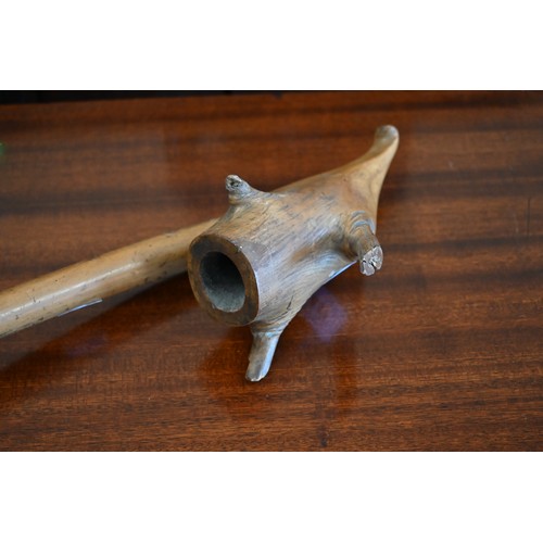 437 - An antique wooden large smoking pipe, 65 cm