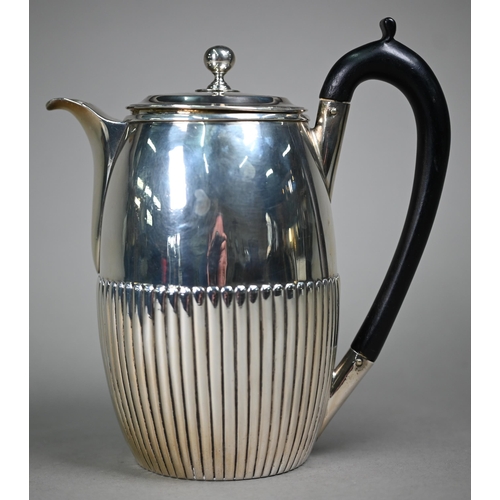 106 - A George III silver coffee jug of ovoid form with ebonised handle and half-reeded decoration, Thomas... 