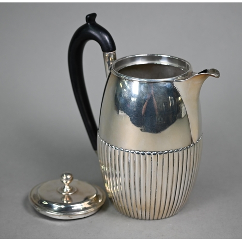 106 - A George III silver coffee jug of ovoid form with ebonised handle and half-reeded decoration, Thomas... 