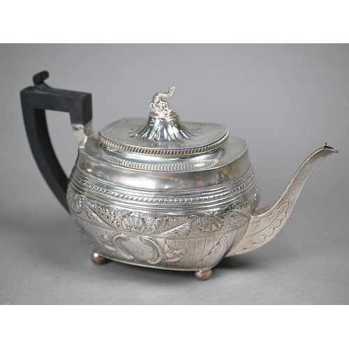 107 - A Victorian silver tea pot in the Regency taste, with dolphin finial and composite handle, on bun fe... 