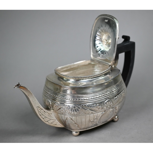 107 - A Victorian silver tea pot in the Regency taste, with dolphin finial and composite handle, on bun fe... 